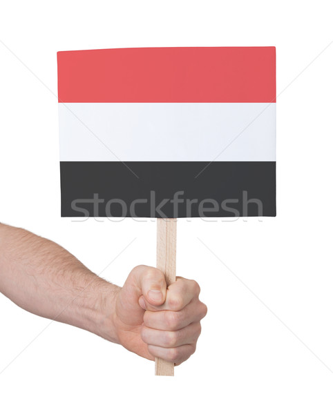 Hand holding small card - Flag of Yemen Stock photo © michaklootwijk