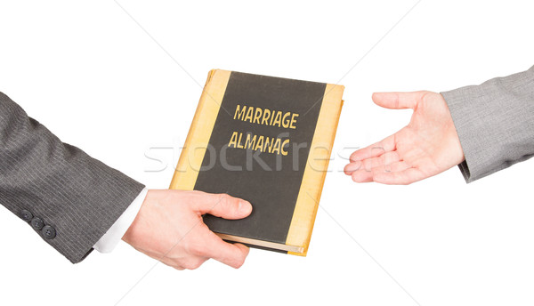 Man and woman holding a marriage almanac Stock photo © michaklootwijk