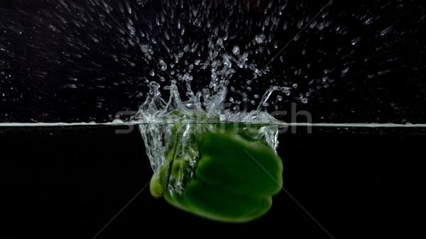 Green pepper with splashing water Stock photo © michaklootwijk