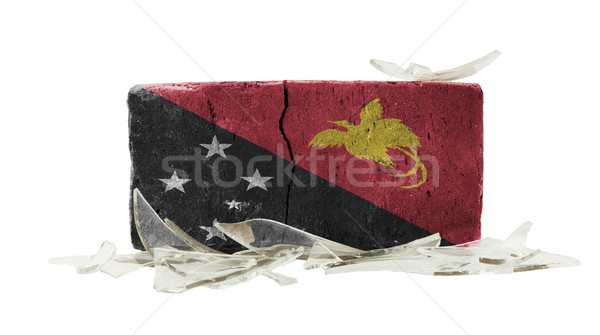 Ladrillo vidrios rotos violencia bandera Papua Nueva Guinea pared Foto stock © michaklootwijk