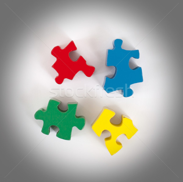 Closeup of 4 big jigsaw puzzle pieces Stock photo © michaklootwijk