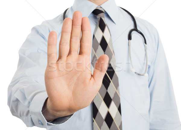 Male doctor holding up his hand in a Halt or Stop gesture Stock photo © michaklootwijk