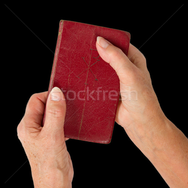 Old hands (woman) holding a very old bible Stock photo © michaklootwijk