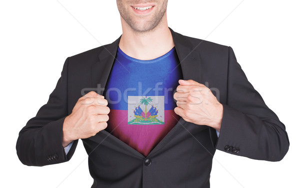 Businessman opening suit to reveal shirt with flag Stock photo © michaklootwijk