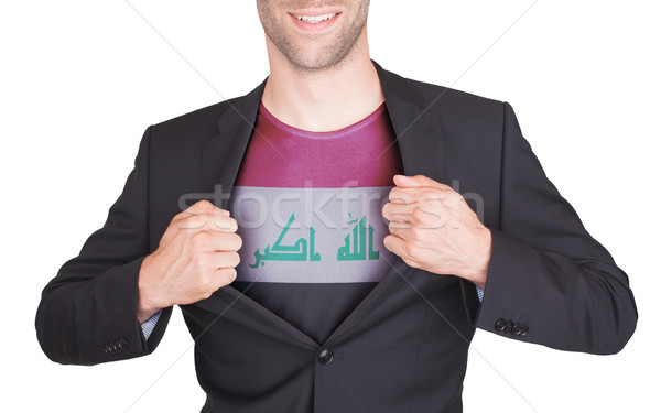 Businessman opening suit to reveal shirt with flag Stock photo © michaklootwijk