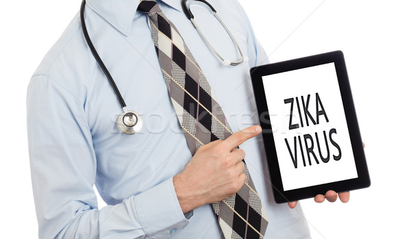 Doctor holding tablet - Zika virus Stock photo © michaklootwijk