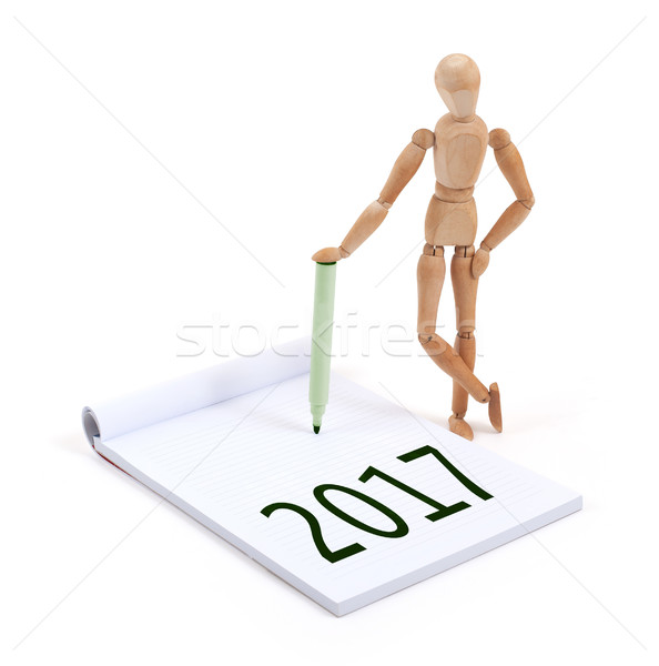 Stock photo: Wooden mannequin writing - 2017