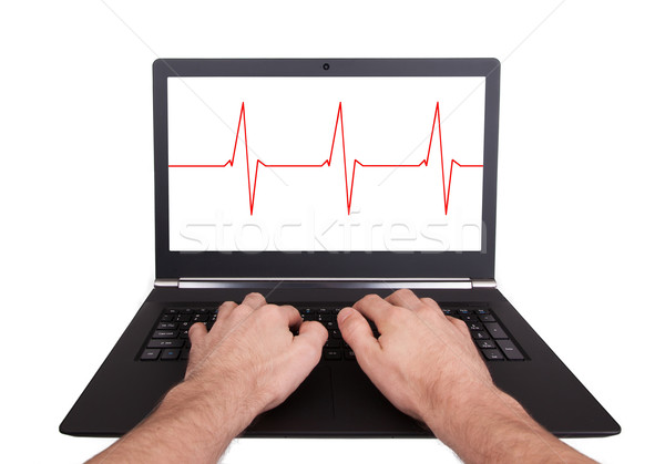 Uomo lavoro laptop battito del cuore isolato computer Foto d'archivio © michaklootwijk