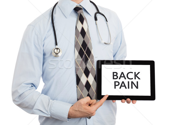 Doctor holding tablet - Back pain Stock photo © michaklootwijk