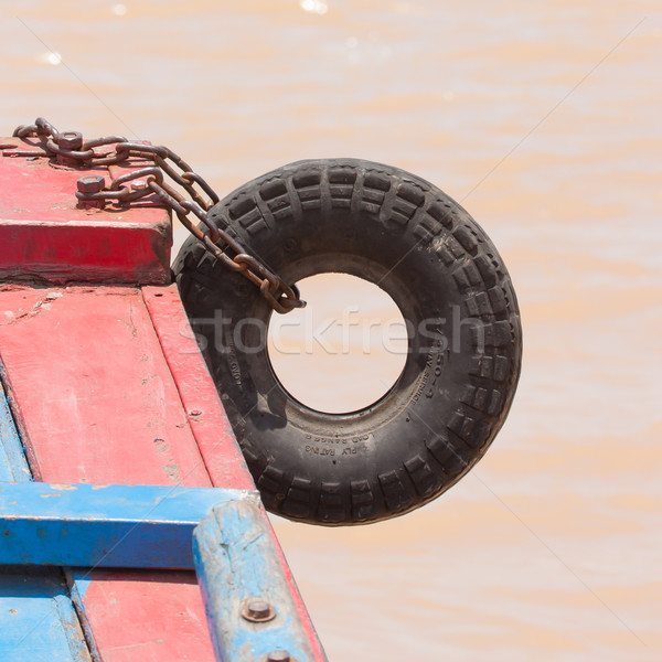 Fender on a red boat in the Mekong delta Stock photo © michaklootwijk