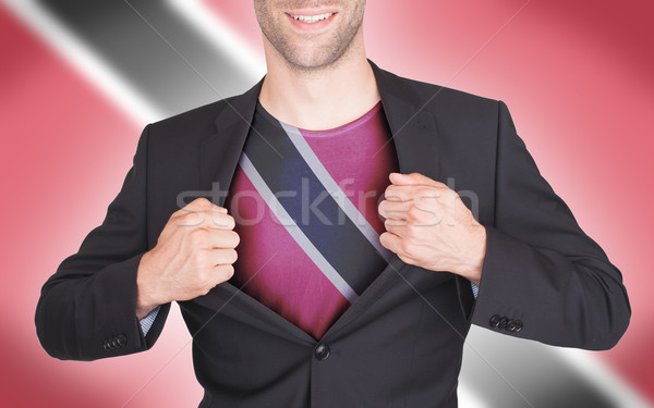 Businessman opening suit to reveal shirt with flag Stock photo © michaklootwijk