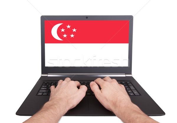 Hands working on laptop, Singapore Stock photo © michaklootwijk