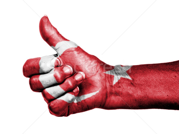 Old woman with arthritis giving the thumbs up sign, wrapped in f Stock photo © michaklootwijk