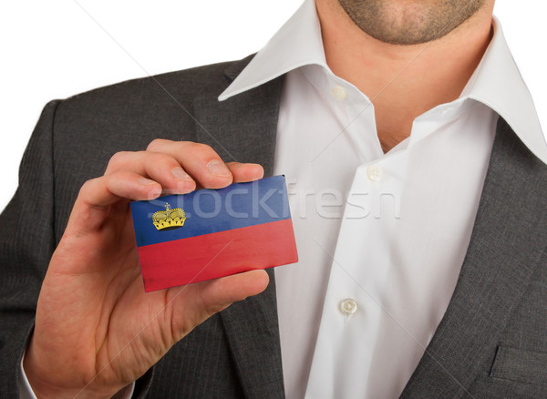 Businessman is holding a business card, Liechtenstein Stock photo © michaklootwijk