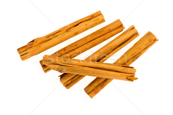 Five cinnamon sticks isolated on white background Stock photo © michaklootwijk