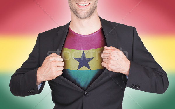 Businessman opening suit to reveal shirt with flag Stock photo © michaklootwijk
