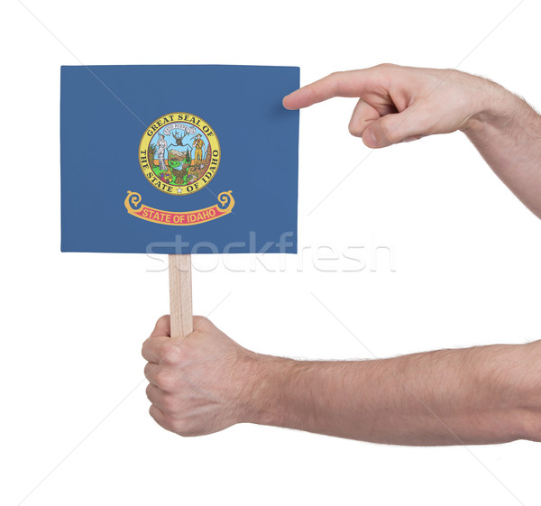 Hand holding small card - Flag of Idaho Stock photo © michaklootwijk