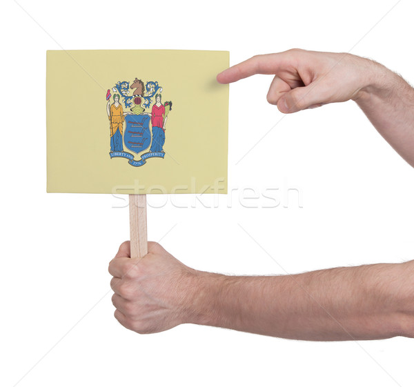 Hand holding small card - Flag of New Jersey Stock photo © michaklootwijk