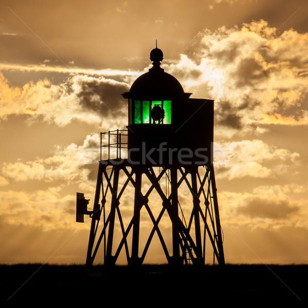 Silhouet groene baken nederlands kust zonsondergang Stockfoto © michaklootwijk