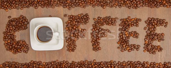 The word Coffee spelled with hundreds of coffee beans and one cu Stock photo © michaklootwijk