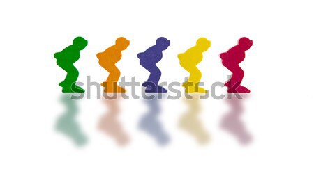 Five colored pawns isolated on a white background Stock photo © michaklootwijk