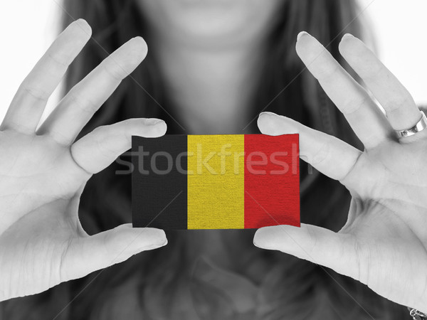 Woman showing a business card Stock photo © michaklootwijk