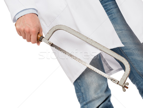 Crazy doctor is holding a big saw in his hands Stock photo © michaklootwijk