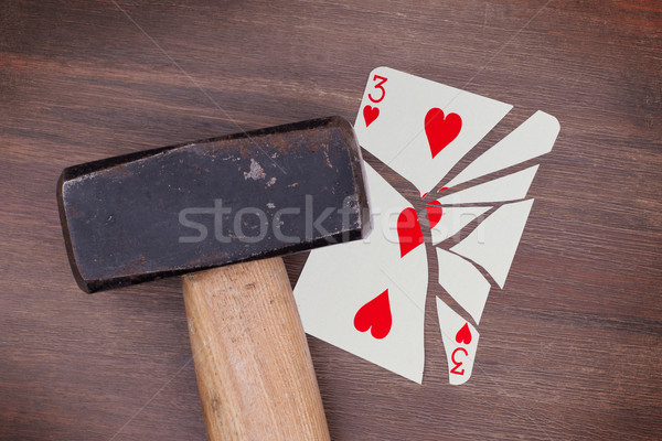 Hammer with a broken card, three of hearts Stock photo © michaklootwijk