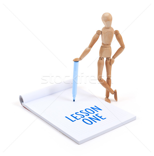 Wooden mannequin writing - Lesson one Stock photo © michaklootwijk