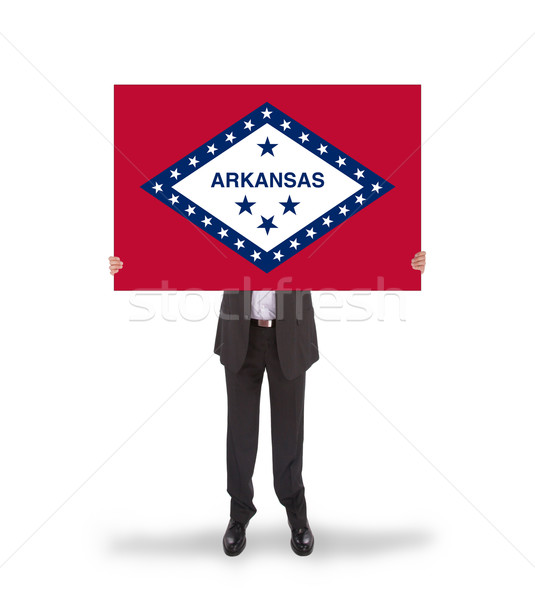 Smiling businessman holding a big card, flag of Arkansas Stock photo © michaklootwijk