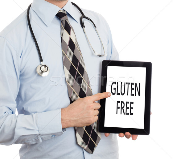 Doctor holding tablet - Gluten free Stock photo © michaklootwijk