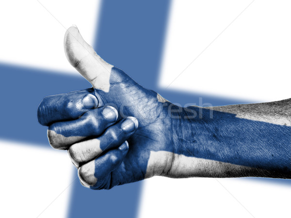 Old woman with arthritis giving the thumbs up sign, wrapped in f Stock photo © michaklootwijk