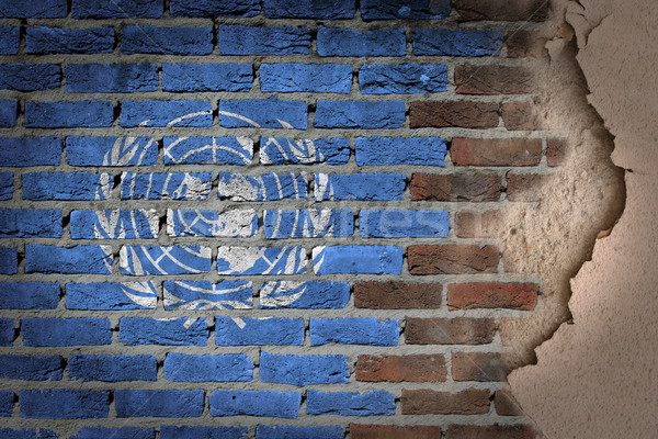 Dark brick wall with plaster - United Nations Stock photo © michaklootwijk