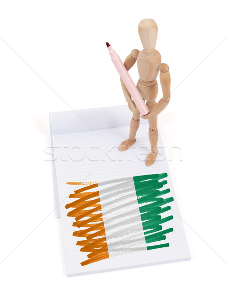 Houten etalagepop tekening Ivoorkust vlag papier Stockfoto © michaklootwijk