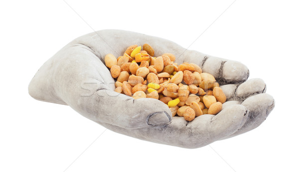 Fresh mixed salted nuts in a bowl (hand), peanut mix Stock photo © michaklootwijk