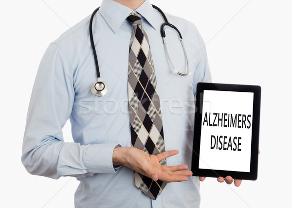 Orvos tart tabletta Alzheimer-kór izolált fehér Stock fotó © michaklootwijk