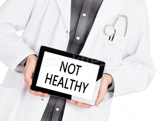 Doctor holding tablet - Not healthy Stock photo © michaklootwijk