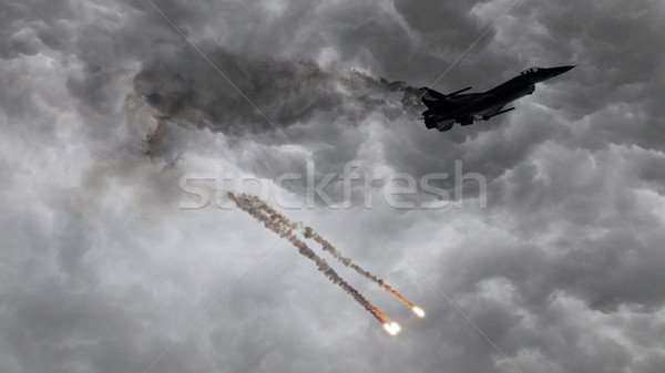 Military jet firing of flares Stock photo © michaklootwijk