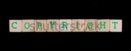 Green letters on old wooden blocks (copyright) Stock photo © michaklootwijk