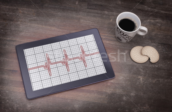 Stock photo: Electrocardiogram on a tablet - Concept of healthcare