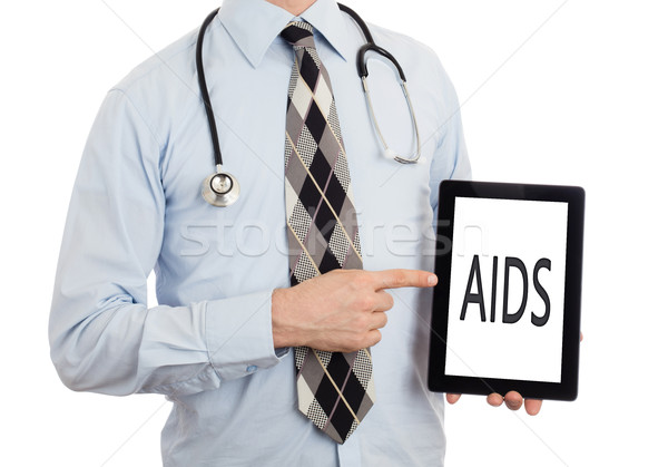 Orvos tart tabletta AIDS izolált fehér Stock fotó © michaklootwijk