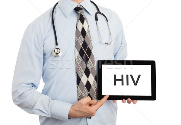 Doctor holding tablet - HIV Stock photo © michaklootwijk