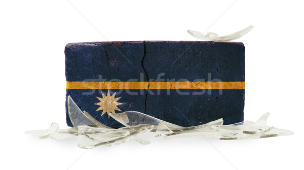 Baksteen gebroken glas geweld vlag Nauru muur Stockfoto © michaklootwijk