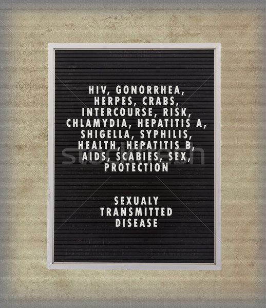 Stock photo: STD concept in plastic letters on very old menu board