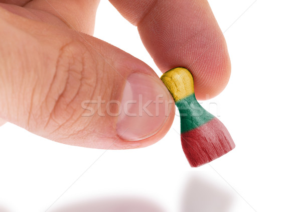 Wooden pawn with a painting of a flag Stock photo © michaklootwijk