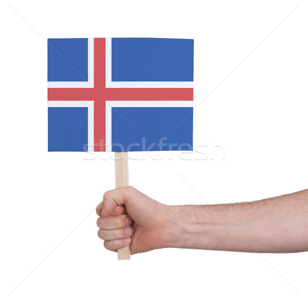 Hand holding small card - Flag of Iceland Stock photo © michaklootwijk