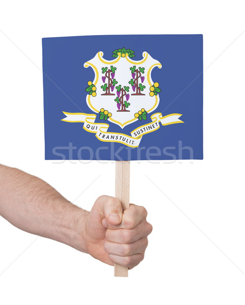 Hand holding small card - Flag of Connecticut Stock photo © michaklootwijk
