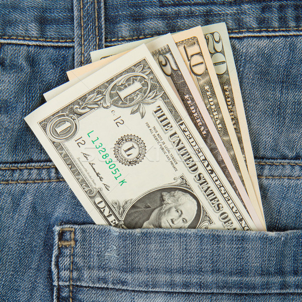 Macro shot of trendy jeans with american four different dollar b Stock photo © michaklootwijk