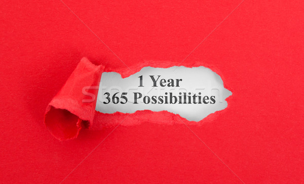 Stock photo: Text appearing behind torn red envelop
