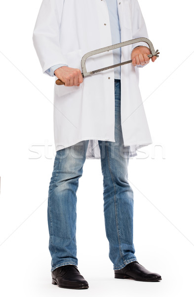 Crazy doctor is holding a big saw in his hands Stock photo © michaklootwijk